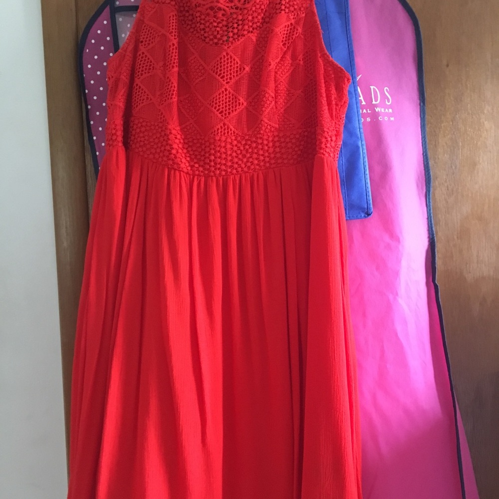 Woman’s red/orange dress with top embroidery